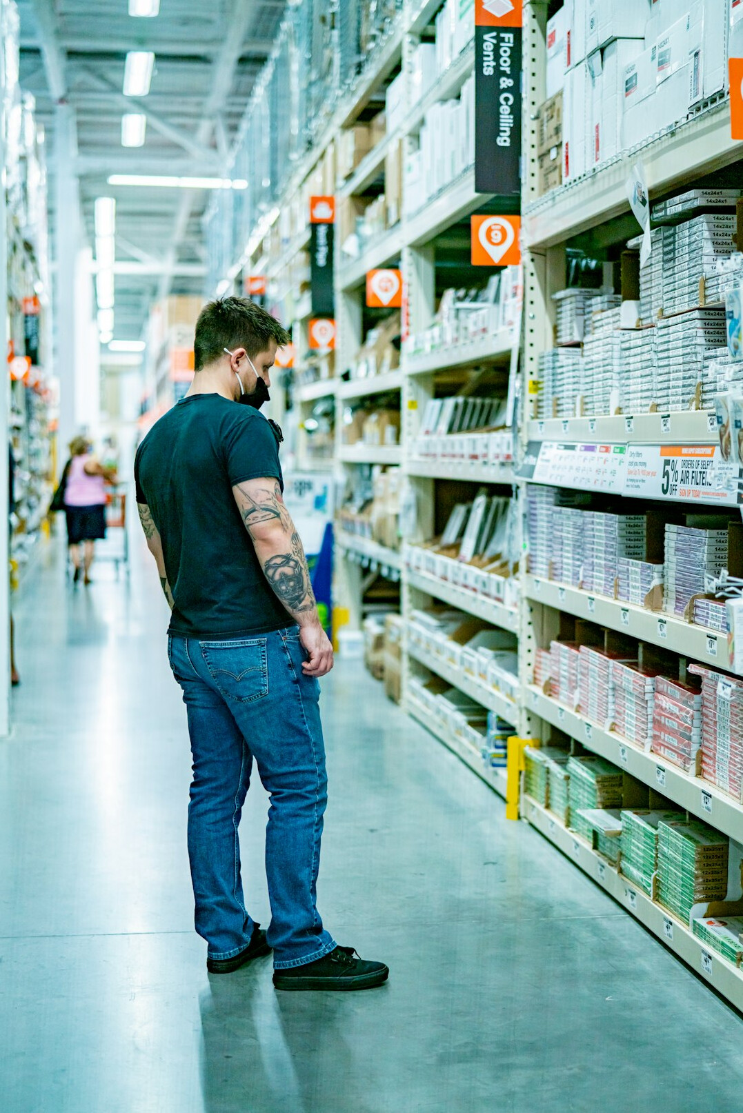 customer browsing supermarket shelves