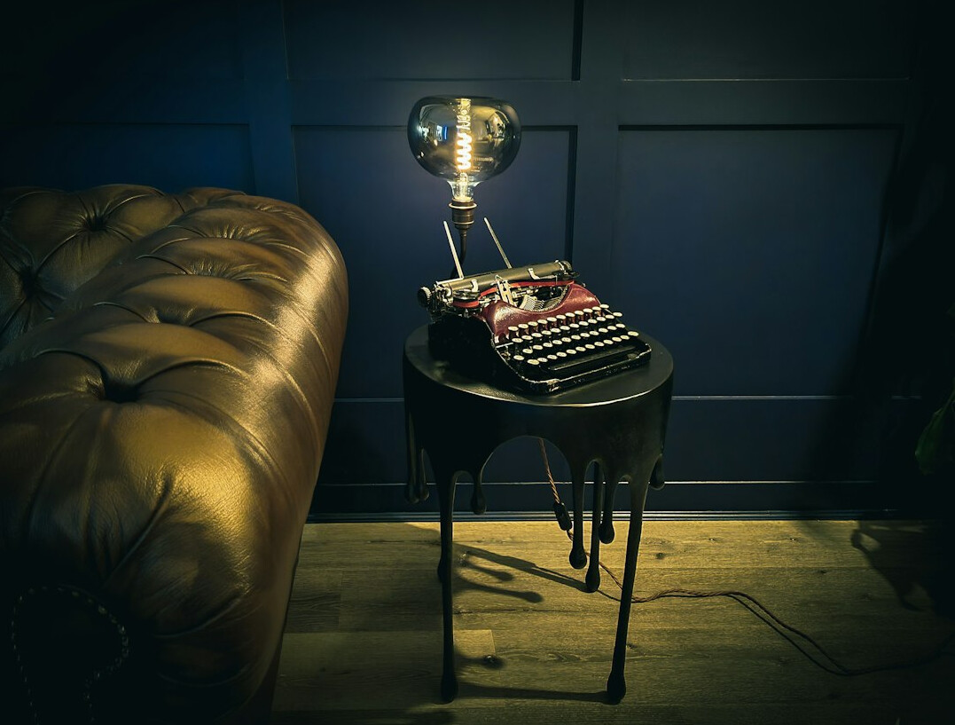 Vintage typewriter with paper on wooden table