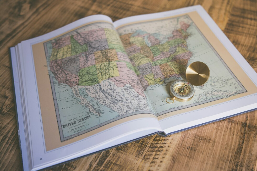 Old paper map spread on a wooden desk
