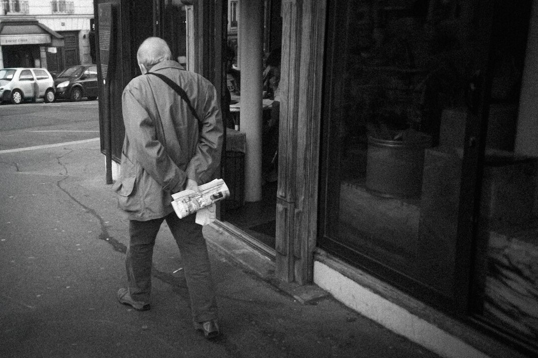 detective following suspect outside store